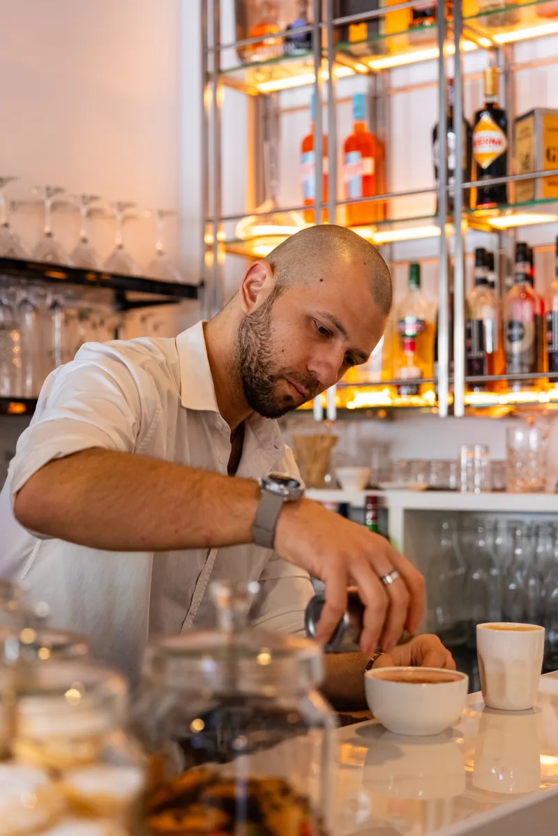 Barista making fresh cappuccino at La Botte D'Oro café in Leichhardt — Sydney's Italian quarter