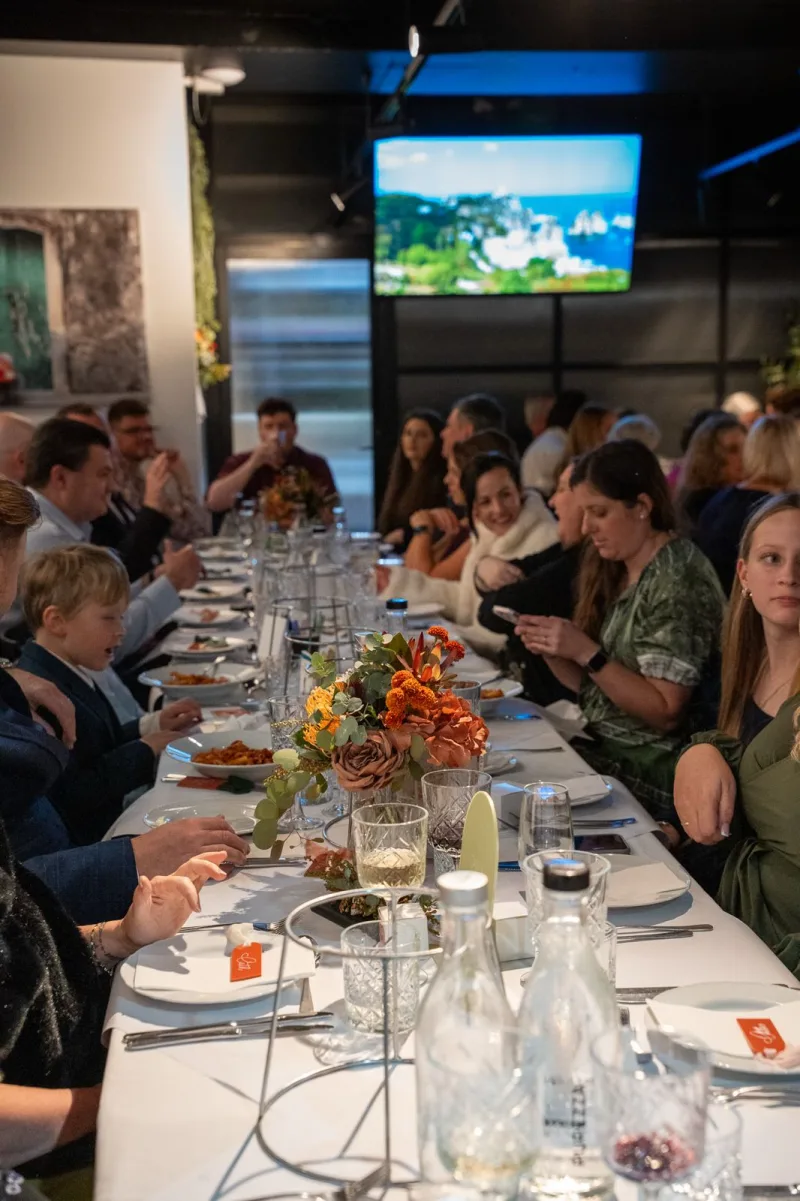Families dining together at a long christening banquet at La Botte D'Oro, Leichhardt