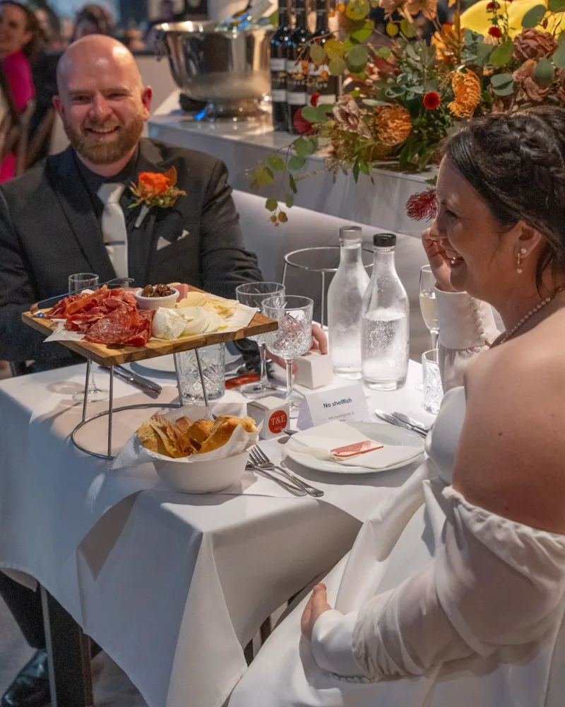 Bride and groom laughing together at their wedding reception at La Botte D'Oro, Leichhardt