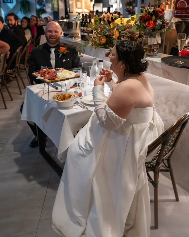 Bride and groom sharing a laugh at their wedding reception at La Botte D'Oro, Leichhardt